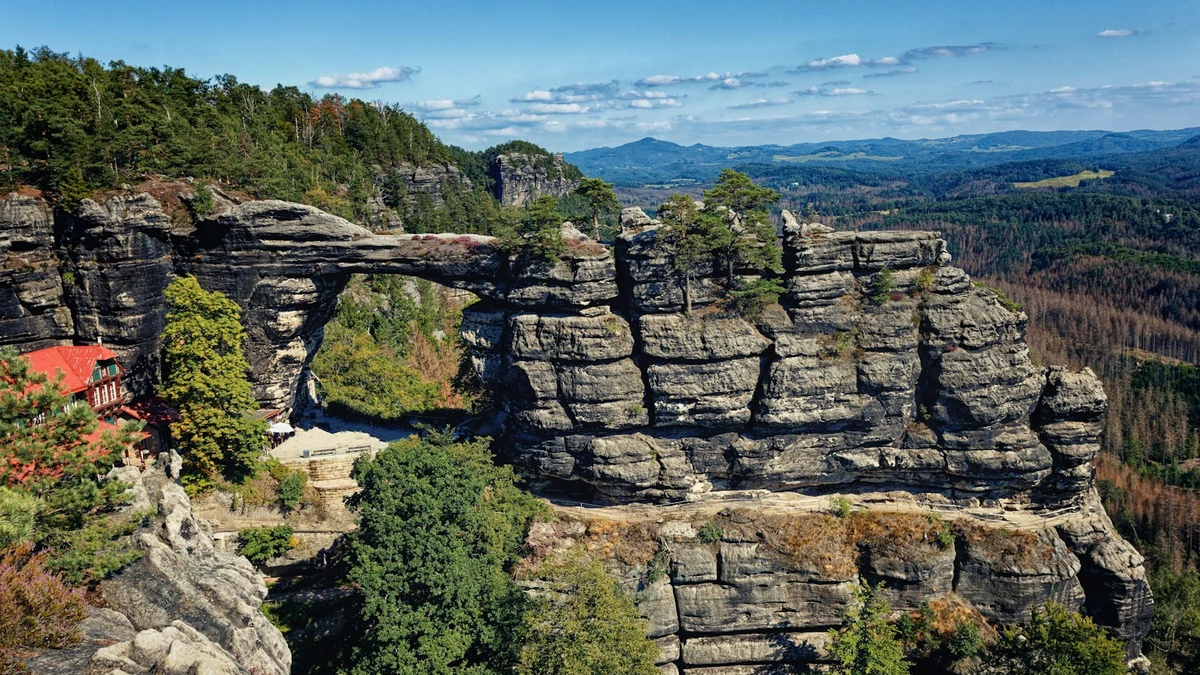 Pravčická brána sandstone arch above forested valleys in Bohemian Switzerland National Park