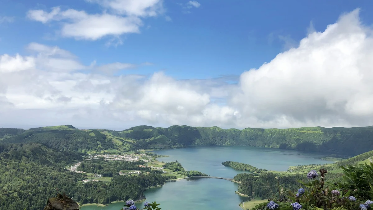 The twin crater lakes of Sete Cidades on Sao Miguel, ringed by green caldera walls and hydrangeas