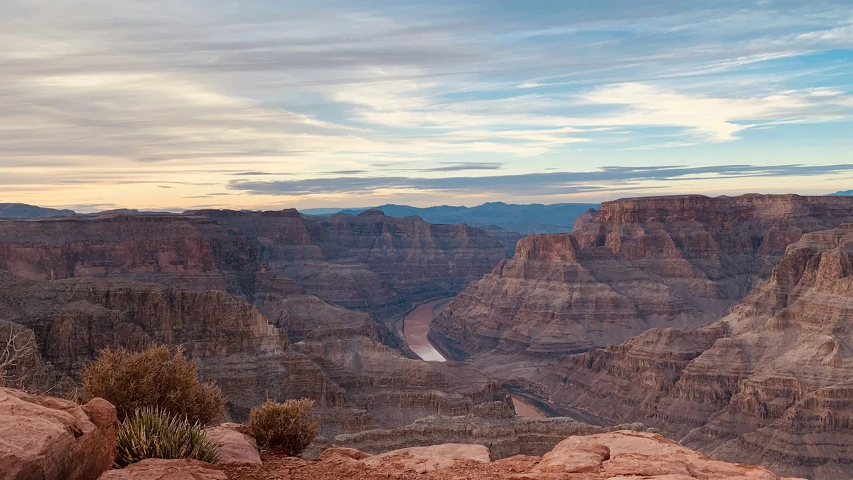 A Grand Canyon overlook at dusk with the Colorado River far below